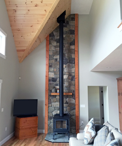 custom stone surround and fireplace mantel remodel