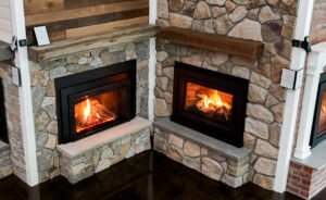 Fire N' Stone of Tilton New Hampshire showroom with dozens of functioning fireplace inserts.