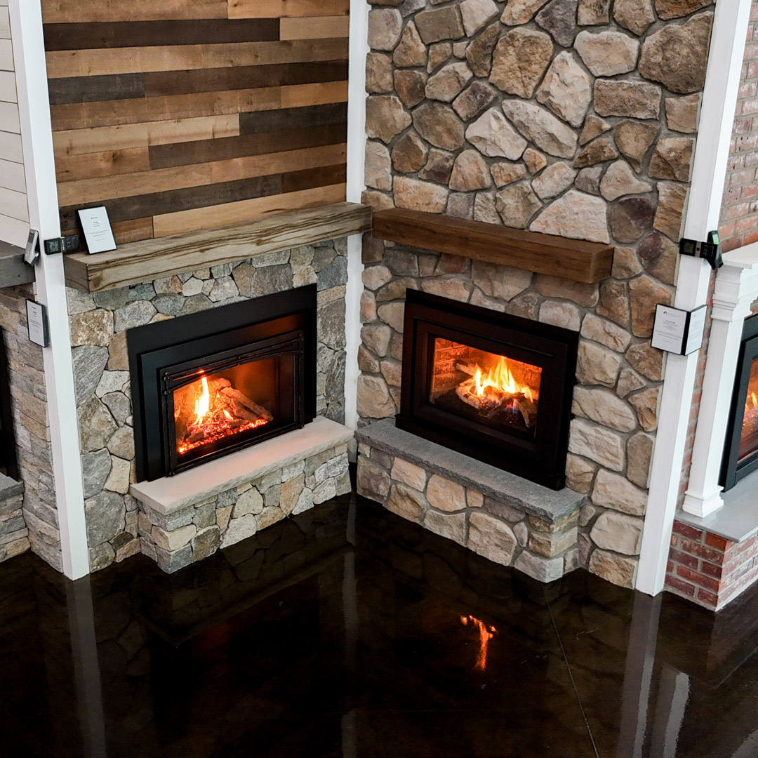 Fire N' Stone of Tilton New Hampshire showroom with dozens of functioning fireplace inserts.