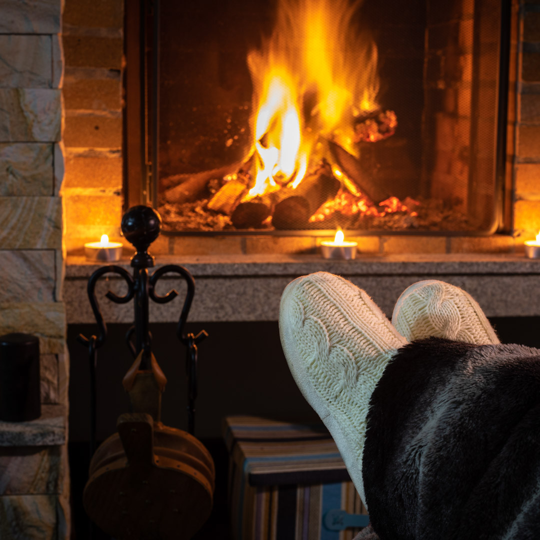 fireplace lit in the comfort of your home in the new hampshire lakes region